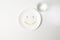 Multivitamin and fish oil capsules in a shape of smile emoji