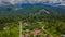 Mulu village with houses and roads surrounded by forest and mountains near Gunung Mulu national park. Borneo. Sarawak.