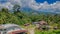 Mulu village with houses surrounded by tropical forest and mountains near Gunung Mulu national park. Borneo. Sarawak.