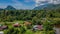 Mulu village landscape with houses surrounded by tropical forest and mountains near Gunung Mulu national park. Borneo. Sarawak.