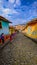 A mum and her child walking in the colourful streets of GuatapÃ©, Colombia