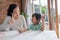 Mum and kid learning maths together at home