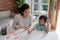 Mum and kid learning maths together at home