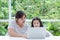 Mum teaches Asian daughters to study online at home