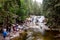 Mumlavsky vodopad waterfall in Krkonose Giant Mountains in the Mumlava river with a lot of tourists and long exposure to create