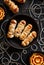 Mummy dogs on a black background  top view