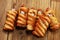 Mummy sausages scary halloween party food decoration wrapped in