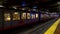 Muni subway train departing from Castro station with commuters, San Francisco