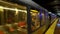 Muni subway train stopping at Castro station while commuters waiting, San Francisco