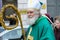 MUNICH, BAVARIA, GERMANY - MARCH 13, 2016: old man disguised as an Irish bishop at the St. Patrick`s Day Parade on March 13, 2016