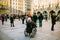 Munich, Germany, December 29, 2016: An elderly woman in a wheelchair examines the sights of Munich on the main square of