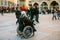 Munich, Germany, December 29, 2016: An elderly woman in a wheelchair examines the sights of Munich on the main square of