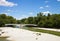 Munich Germany, people relax sun bathing on Isar river banks near Kabelsteg bridge in center city