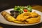 Munich style` Schnitzel Breaded and Buttered Deep Fried Porkloin Served with Greens, Dijon Mustard, Potato Salad and Lemon Wedge