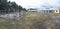 Municipal animal shelter. Row of open air cages, stray dogs barking