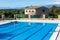 Municipal swimming pool with mountains in the background in Costitx, Mallorca, Spain