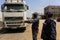 A municipal worker disinfects a truck at a checkpoint in Rafah in the southern Gaza Strip