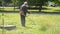 Municipal worker mows the grass in