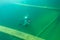 Munising, MI -August 13th, 2021: SCUBA diver entering wooden schooner shipwreck