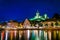 The munot fortress in the swiss city schaffhausen is reflected on the rhine river at night in summer....IMAGE