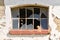 Muntin window with broken glass of old abandoned building