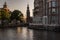The Munttoren tower reflected in the canal, Amsterdam, Netherlands