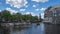 The Munttorenin Tower with Amsterdam city skyline in Amsterdam, Netherlands