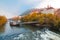 Mur river in autumn, with Murinsel bridge and old buildings in the city center of Graz, Styria region, Austria