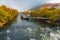 Mur river in autumn, with Murinsel bridge and old buildings in the city center of Graz, Styria region, Austria