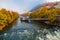 Mur river in autumn, with Murinsel bridge and old buildings in the city center of Graz, Styria region, Austria