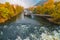 Mur river in autumn, with Murinsel bridge and old buildings in the city center of Graz, Styria region, Austria