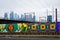 Mural along Spring Garden Street and view of the skyline, in Philadelphia, Pennsylvania