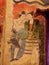 Mural painting of a man whispering to ear of a women in wat Phumin, nan, thailand