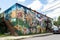 murals depicting the story of a neighborhood, chronicling its history and culture