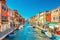 Murano island, bridge across water canal, boats, motor boats