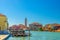 Murano islands water canal, Palazzo da Mula palace, boats, San Pietro Martire church building, Venetian Lagoon