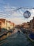 Murano, Italy - February 2019: Main canal in Murano during a sunny early morning