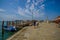 MURANO, ITALY - JUNE 16, 2015: Nice brick floor at Murano wood port, people around