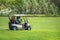 Murcia, Spain, August 25, 2019: Sportman riding a golf cart in the goulf course