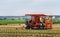 Murcia, Spain, December 12, 2019: Modern machinary for cultivation of lettuces in new plantation. Tractor in agricultural field in