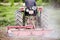 Murcia, Spain, May 8, 2020: Farmworker riding tractor tilling or plowing the earth. Preparation to cultivate in