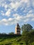 Murmansk lighthouse view from below, enclosed by a fence and a beautiful sky from above. Cityscape of Murmansk - a city