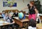 Murmansk, russia - September 17, 2013, Children studying geography in the classroom using the Globe