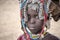 Mursi Girl with rich head decoration