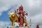Murti of Durga Maa, Mother Goddess Durga, with golden lion at the entrance to the Ganga Talao Temple at Grand Bassin, Mauritius