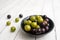 Muscadine grapes are also known as swamp grapes, Florida grapes in a bowl on wood background