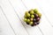 Muscadine grapes are also known as swamp grapes, Florida grapes in a bowl on wood background