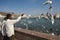 MUSCAT/OMAN 15TH JANUARY 2007 - Indian migrants feed gulls in Mu