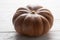 Muscat pumpkin on white wooden background