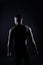 Muscle, body and skin, portrait of black man on dark background with serious face for art aesthetic.